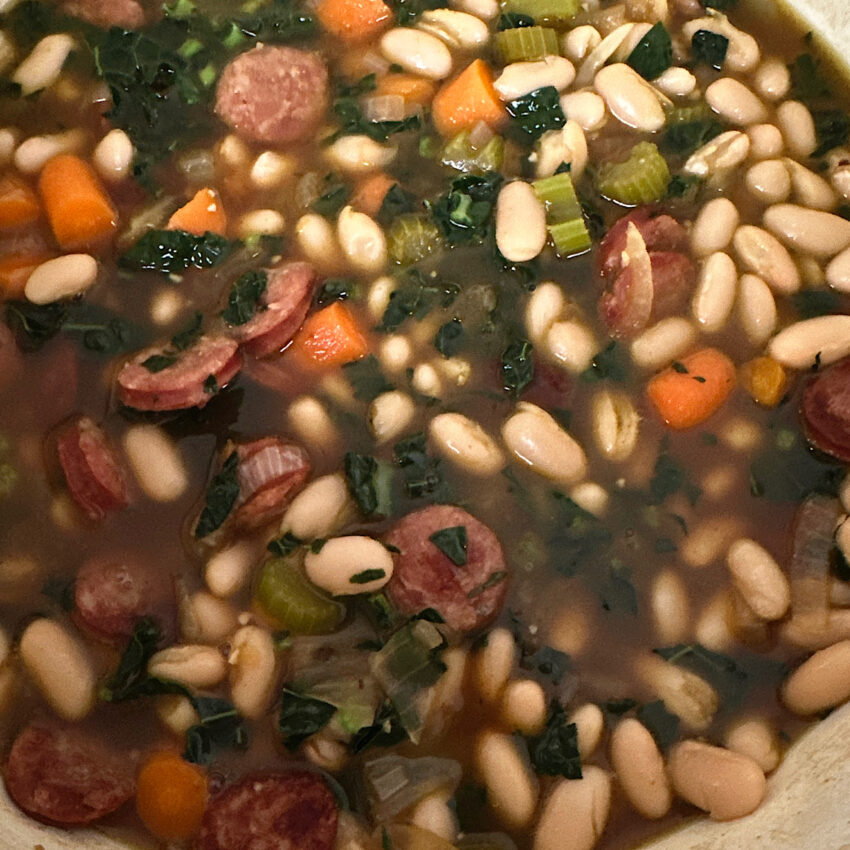 Stew of white beans, carrots, onions andouille sausage and chicken stock.