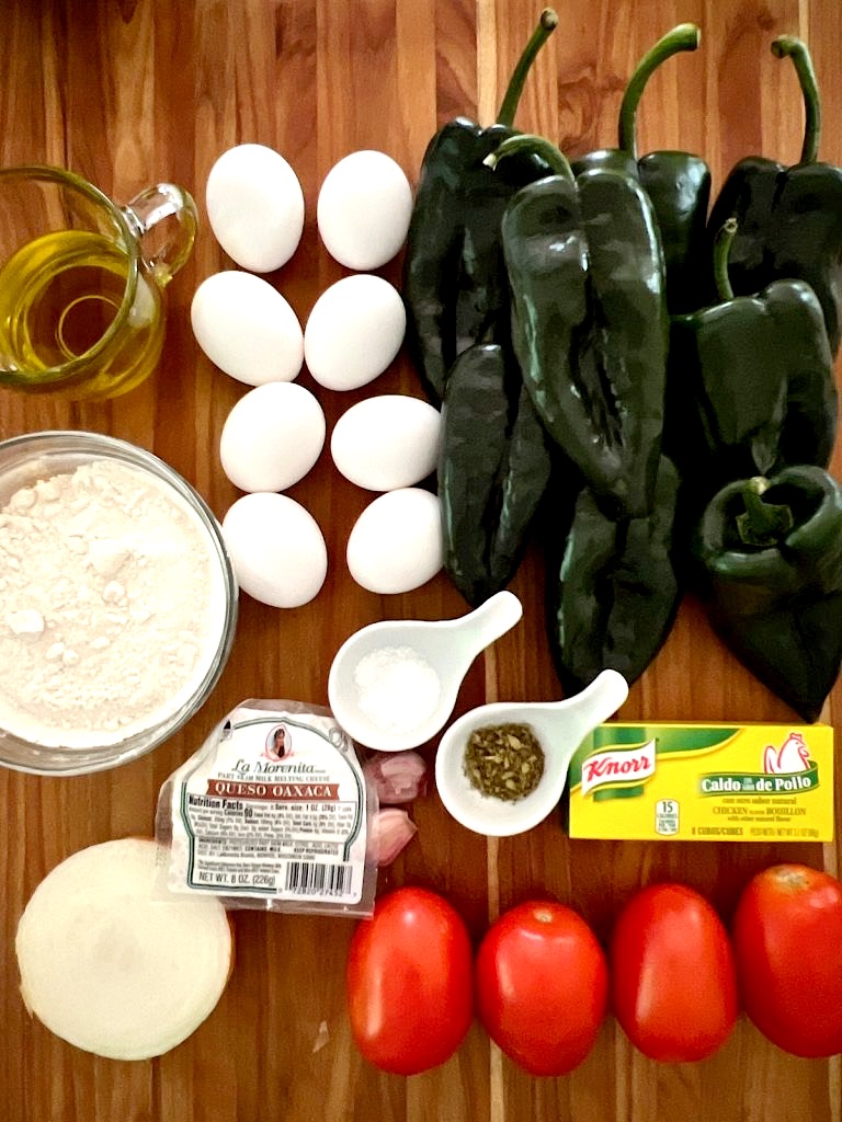 Ingredients for Chile Rellenos laid out on a cutting board.