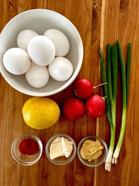 Ingredients for egg salad sandwich with mayonaisse, mustard and smoked paprika.