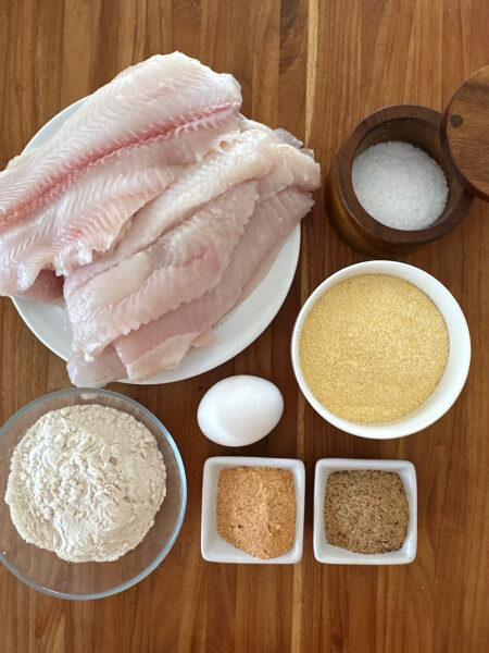 Ingredients for baked catfish filets breaded with cornmeal and a fish spice rub