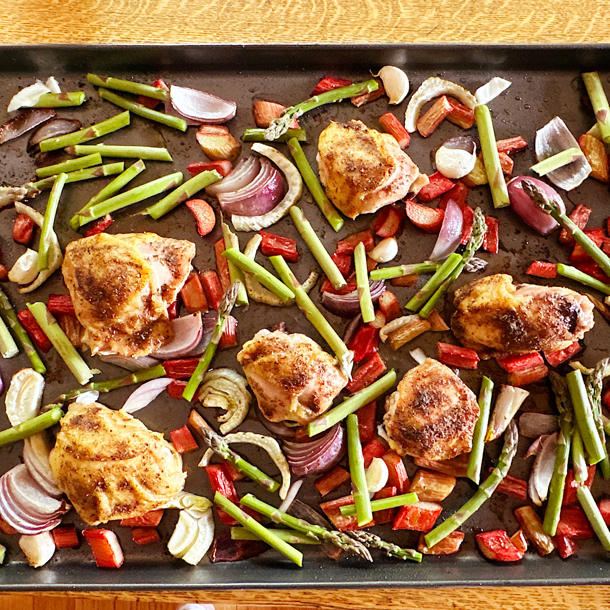 Chicken, rhubarb, asparagus and fennel  on sheet pan.