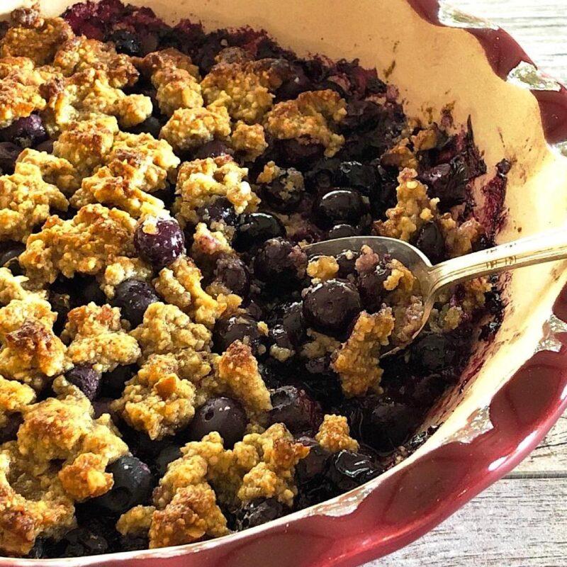 Low carb version of a blueberry crumble in a baking dish.