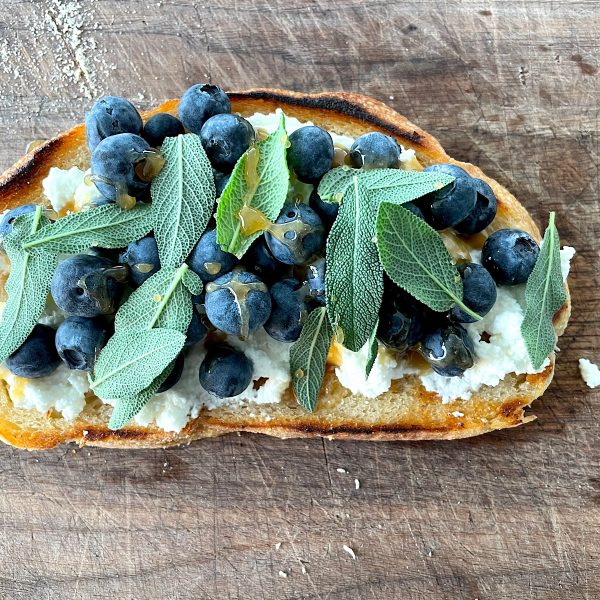 Blueberry toast with ricotta, sage and honey.