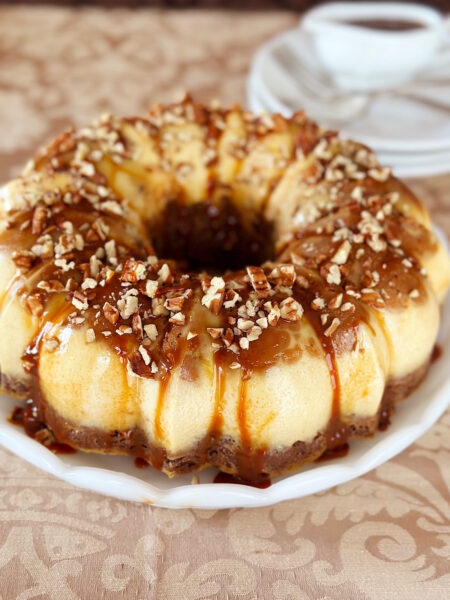 Chocoflan (aka Impossible Cake) with caramel sauce in background.