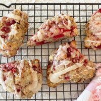 Raspberry and Black tea scones on a wire rack after baking.