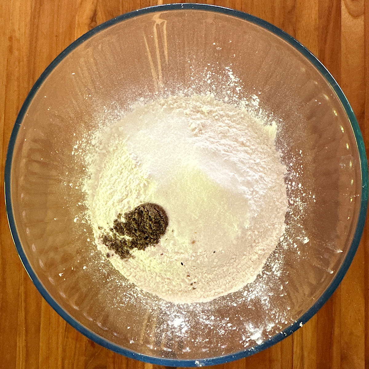 Bowl of flour, sugar, salt and cardamom for raspberry scone recipe.