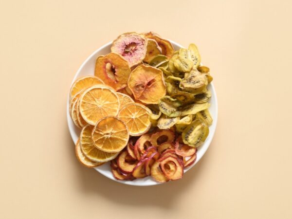 Dried fruits arranged on a white plate.