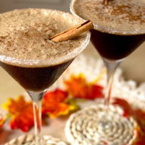 Espresso martini with pumpkin spice flavor and cinnamon stick garnish.