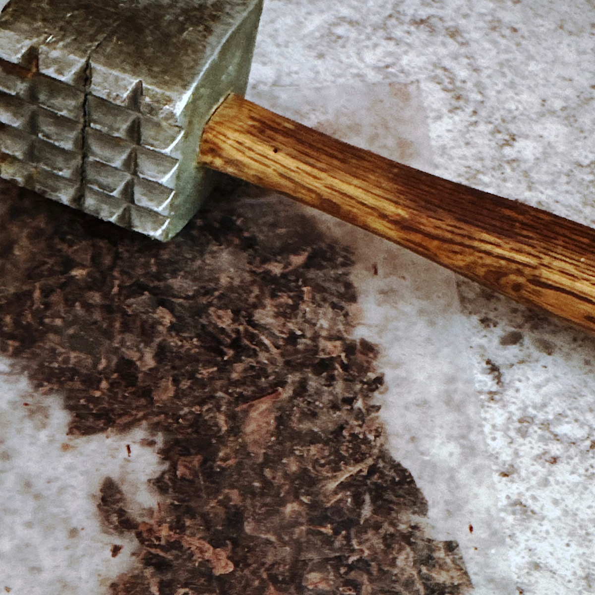 Dark chocolate pounded with mallet into small pieces.