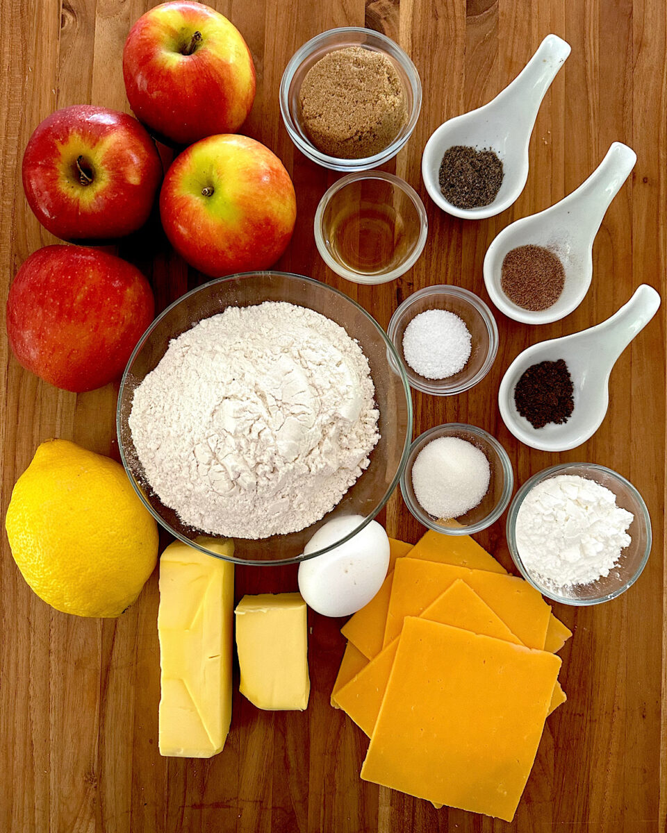 Ingredients for apple cheese galette on a cutting board.