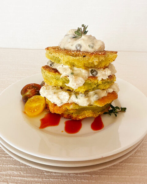 Crab stack of 3 fried green tomatoes layered with crab remoulade