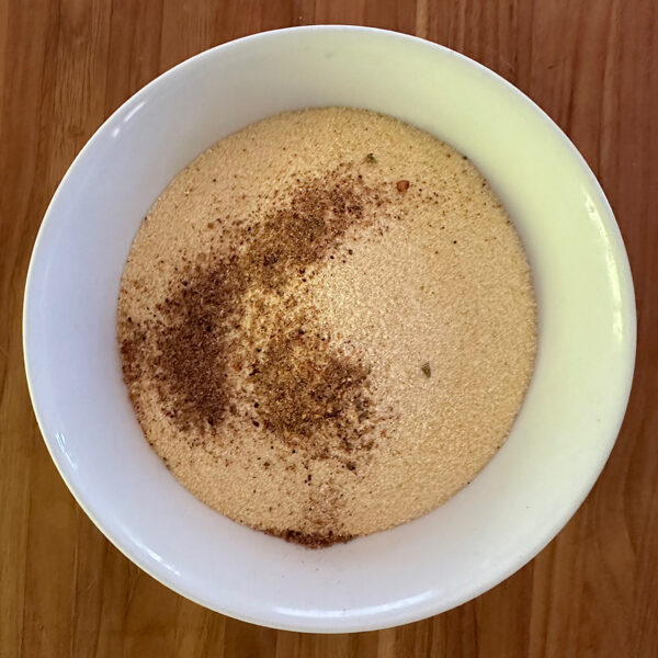 Cornmeal with cajun spices in a bowl