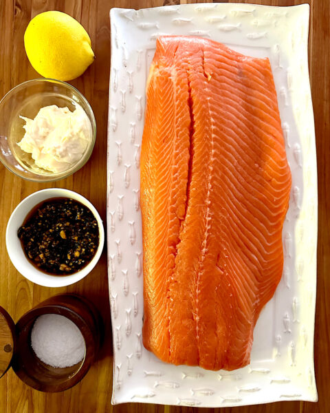 Ingredients for mayonnaise covered salmon with side of salsa macha.
