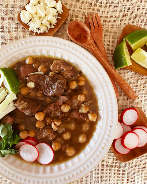 Pozole with garbanzo beans, radish, limes and cheese