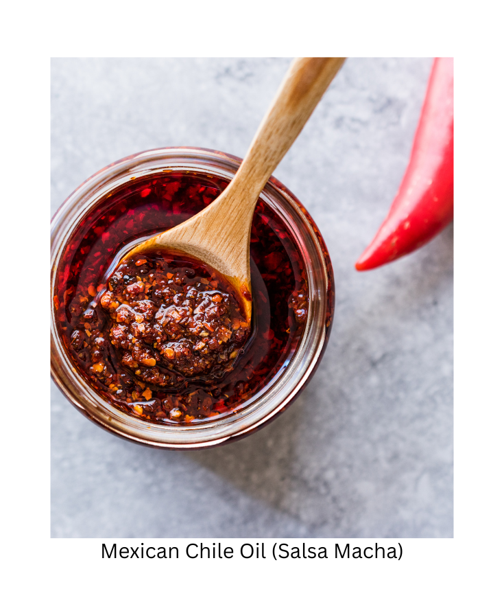 small bowl of chile oil (salsa macha) with tip of red pepper showing.
