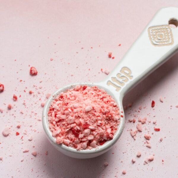 Crushed peppermint in a measuring spoon.