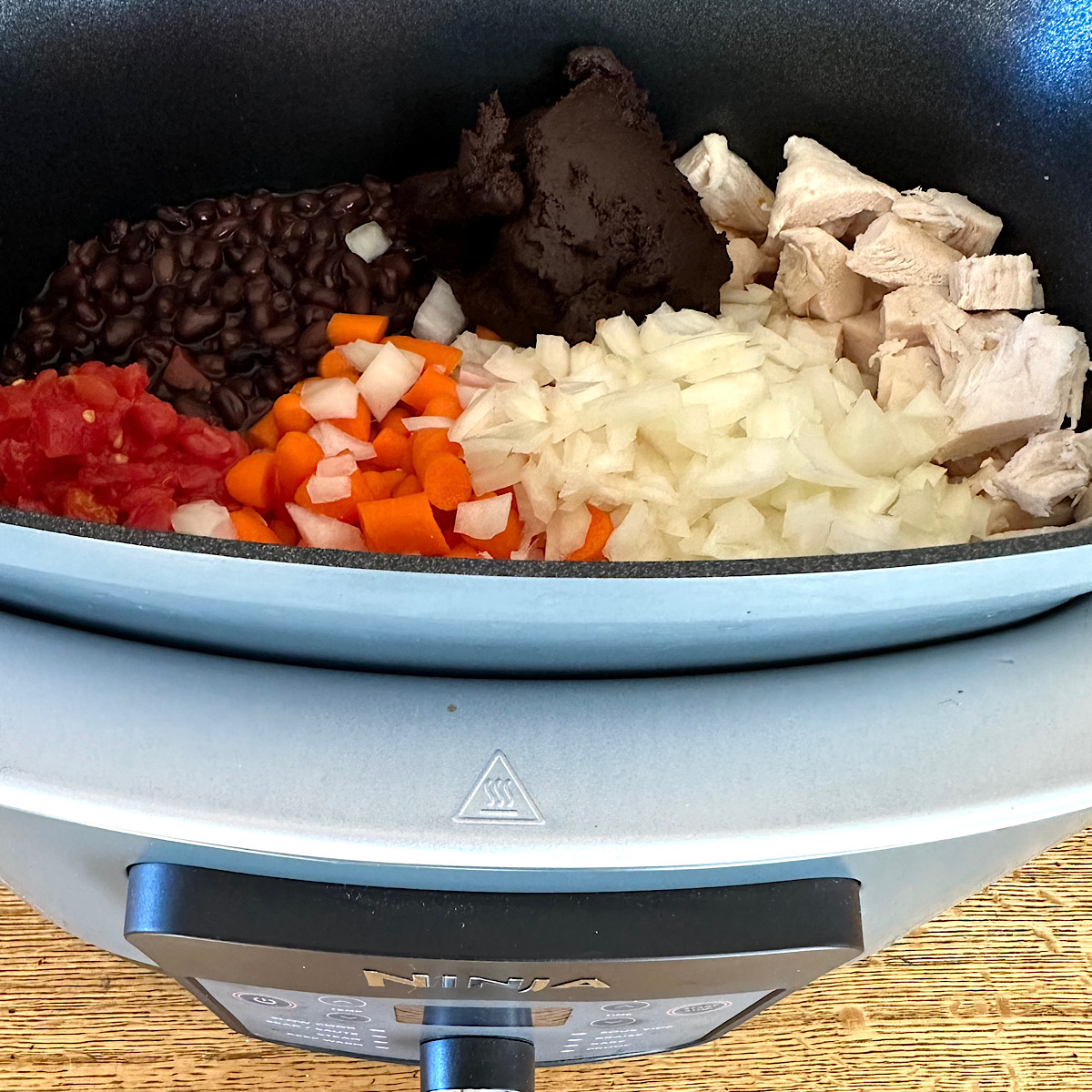 Turkey mole chili ingredient in a crockpot.