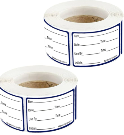 Two roles of white stickers for labeling and dating items that will be frozen in containers.