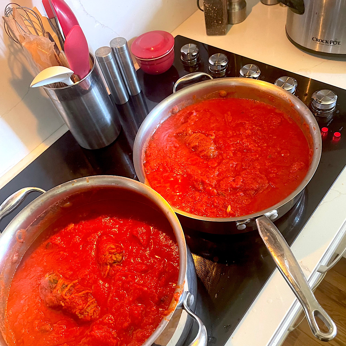 Braciole simmering in tomato sauce