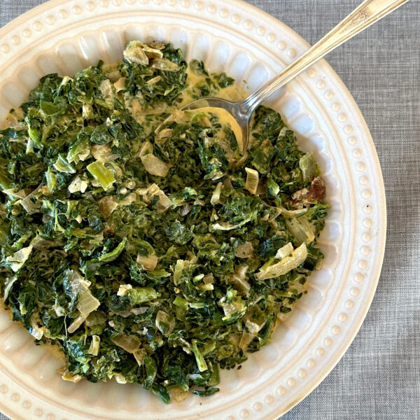 creamed spinach in a white bowl.