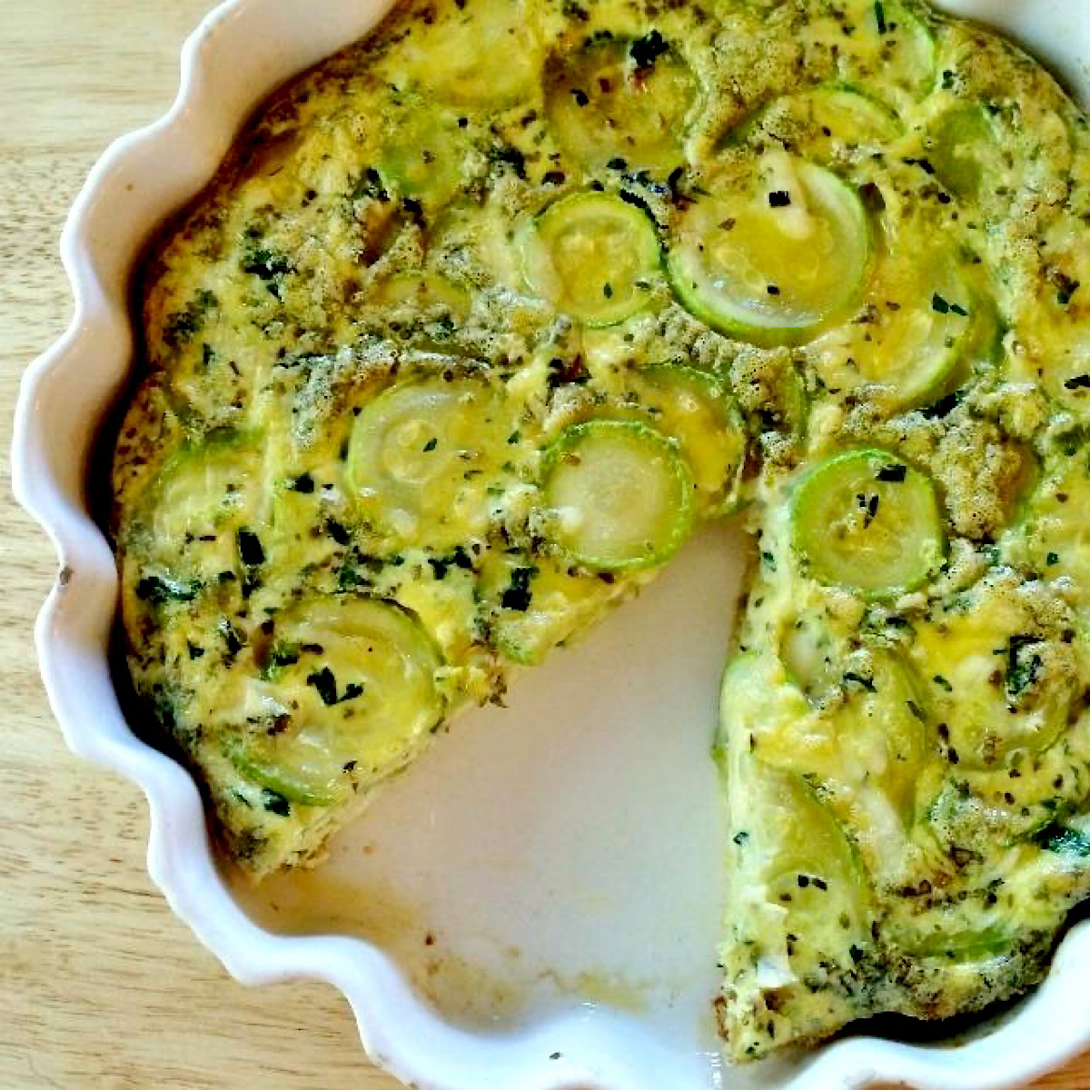 Zucchini frittata in a white baking dish