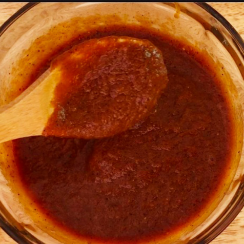 Low carb BBQ sauce in a bowl with spoon.