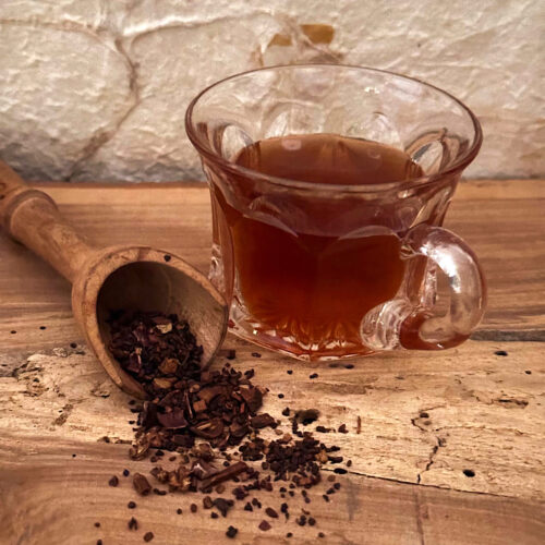 Herbal moka java looseleaf wellness tea from HeathGlen Organic Farm. Brewed in a cup and loose in a spoon. looseleaf from Dorothy Stainbrook's Wellness tea collection