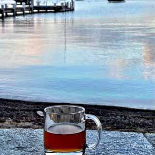 Cup of rooibos tea on deck at sunrise in Lake Tahoe