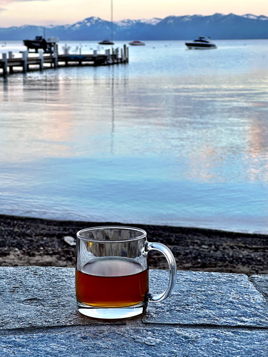 Cup of  rooibos tea on deck at sunrise in Lake Tahoe