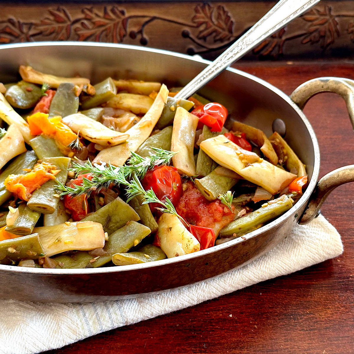 Italian Romano beans with smashed cherry tomatoes.