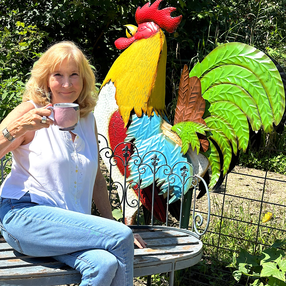 Dorothy drinking tea in the rooster garden.