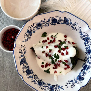 Mexican chiles en nogada in a blue and white bowl.