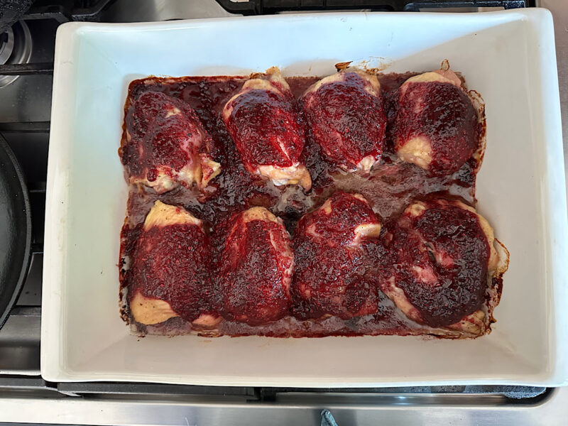 Raspberry Chipotle chicken thighs in a baking dish.