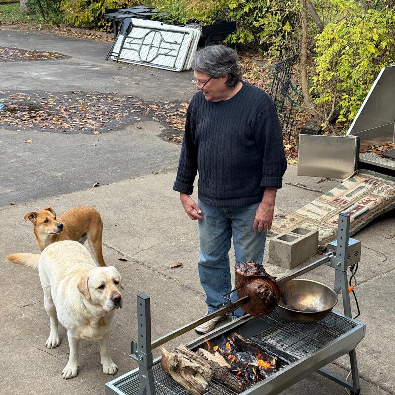 Roasting meat on an outdoor smoker set-up at HeathGlen Farm.