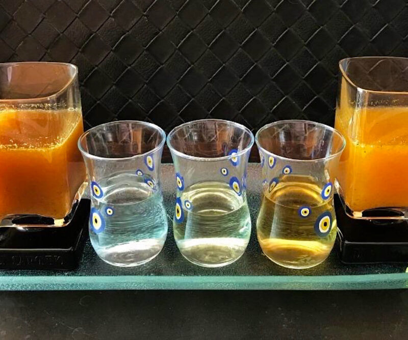 Tequila flight with two sangritas: a tomato sangrita and an orange sangrita.