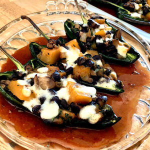 Stuffed poblano peppers with black beans, squash and cheese.
