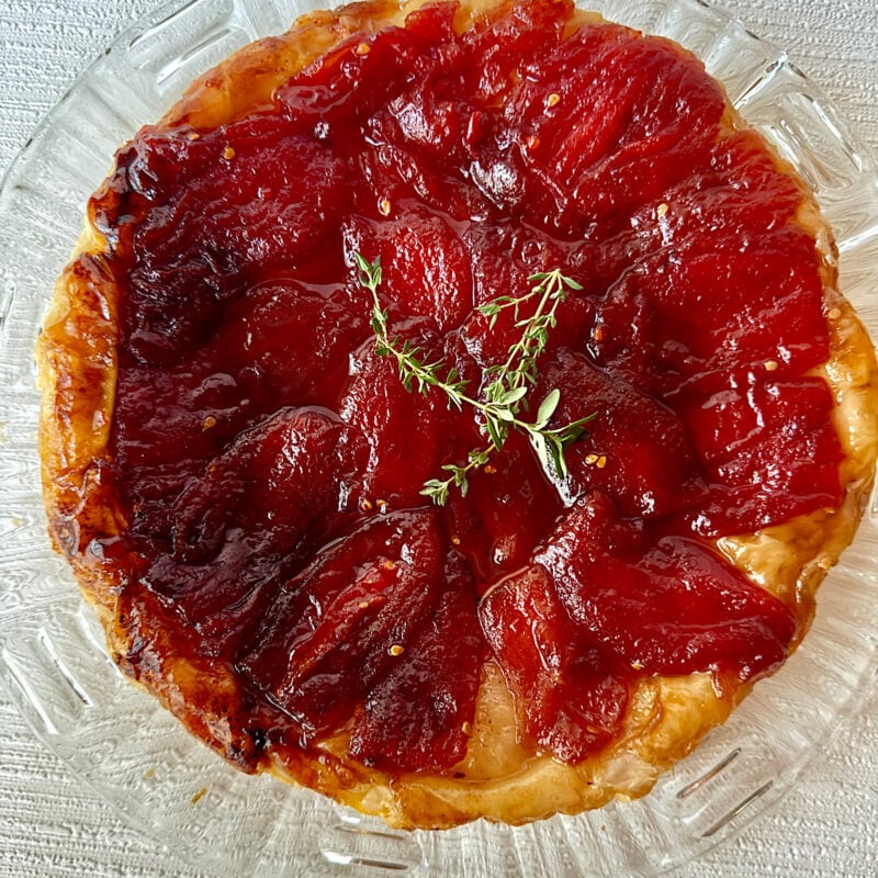 Tomato Tarte Tatin made with Roma tomatoes from HeathGlen Farm and garnished with sprigs of thyme.